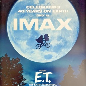ET Imax Movie Poster with Elliot on bike in front of moon.