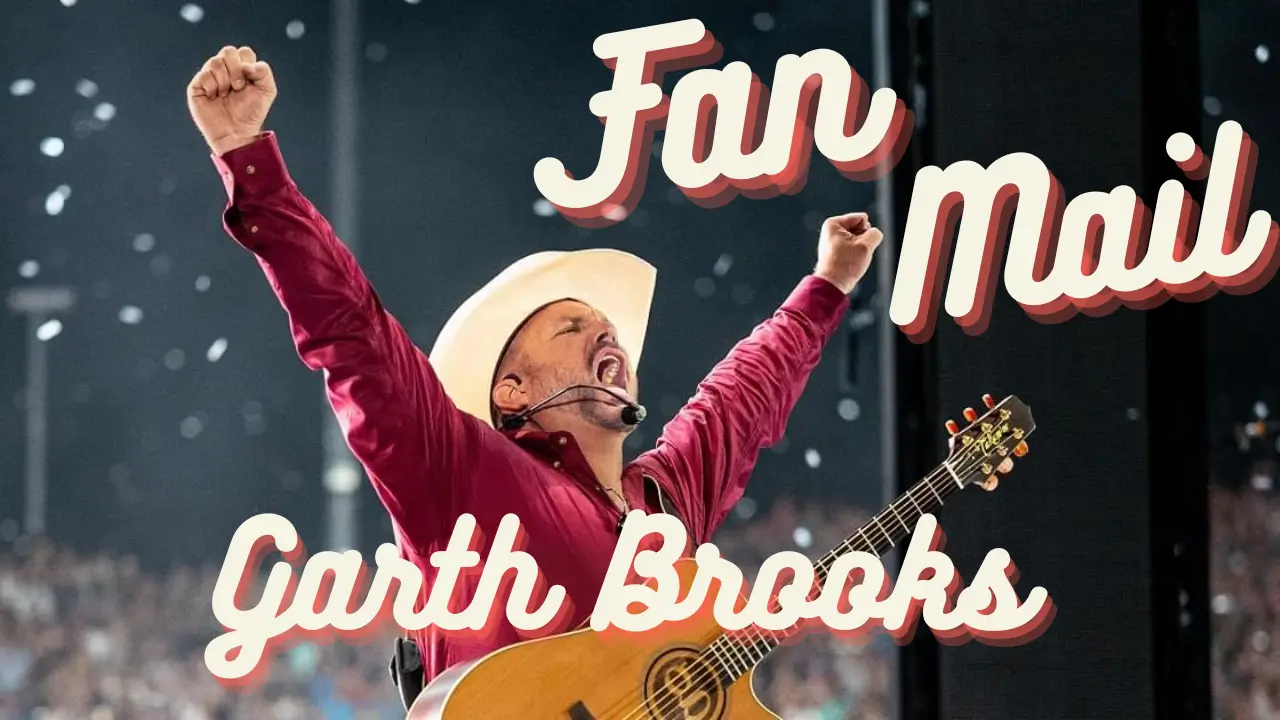 Title: Garth Brooks Fan Mail. Garth Brooks with hands raised on stage at a concert.