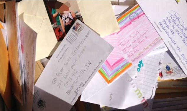 A pile of letters sent to Taylor Swift found in a dumpster by a fan. The fan mail is all addressed to Swift.