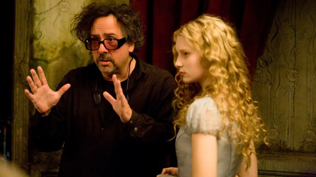 Still of Tim Burton and Mia Wasikowska in Alice in Wonderland