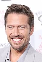 Photo of Alexis Denisof